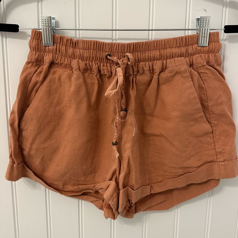 Burnt orange shorts with cinched waistband and pockets, size S